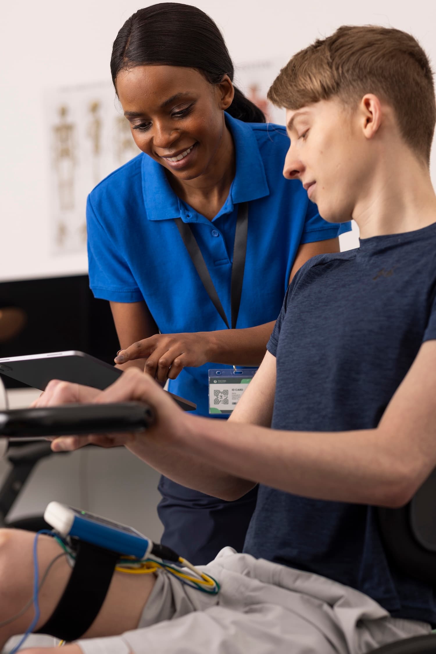 Clinician and client using the Stim2Go app to control FES cycling